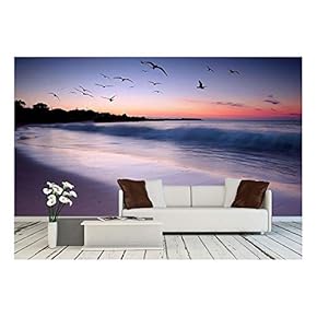 Waves Crashing on Beach at Sunset with Birds Flying by - Removable Wall Mural | Self-Adhesive Large Wallpaper - 66x96 inches