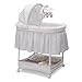 Simmons Kids Gliding Bedside Bassinet - Portable Crib with Activity Mobile Arm Featuring Spinning Toys, Vibration, Nightlight and Music, Peacock