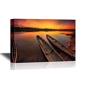Dramatic Sunset in The Amazon Rain Forest with Two Canoes