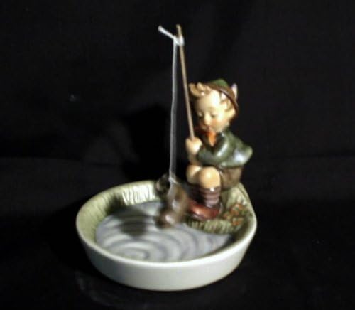 boy fishing figurine