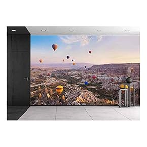Hot Air Balloon Flying Over Rock Landscape at Cappadocia Turkey - Removable Wall Mural | Self-Adhesive Large Wallpaper - 66x96 inches