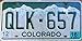 Colorado License Plate Green numbers on White Mountain