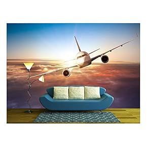 Commercial Airplane Flying Above Clouds in Dramatic Sunset Light - Removable Wall Mural | Self-Adhesive Large Wallpaper - 66x96 inches