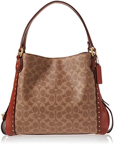 edie shoulder bag 31 in signature canvas with rivets