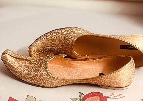 white and gold slippers