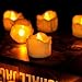 Youngerbaby 12pcs Amber Flicker LED Tea Lights Wax Dripped Battery Operated Candle Unscented Small Led Flameless Candles with Timer -6hr On-18 Hr Off for Christmas Wedding (12pcs Flickering Yellow)