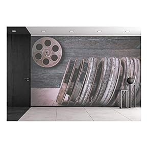 Stack of reels of Old Movies is on a Wooden Shelf - Removable Wall Mural | Self-Adhesive Large Wallpaper - 100x144 inches