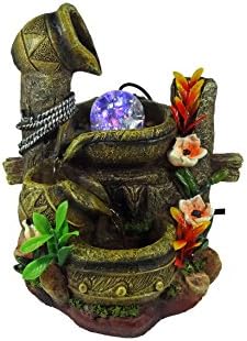Indoor Tabletop Fountain Cascading Jars Near Flower And Fence
