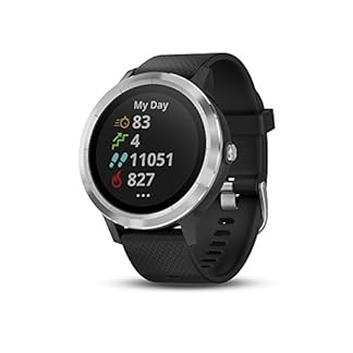 Garmin Vivoactive 3 smartwatch with a circular face featuring a black bezel and a silver case. The watch has a touchscreen display showing the time '10:08' in a digital format, with the date 'Fri 13' below it. The watch strap is black silicone, designed for comfort, and includes multiple activity tracking icons on the screen such as heart rate, steps, and calories. The background is white, providing contrast to highlight the smartwatch's design