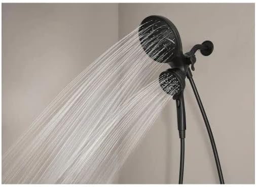 Both the fixed and handheld Moen Magnetix shower heads are shown with water flowing, illustrating the combined spray functionality.