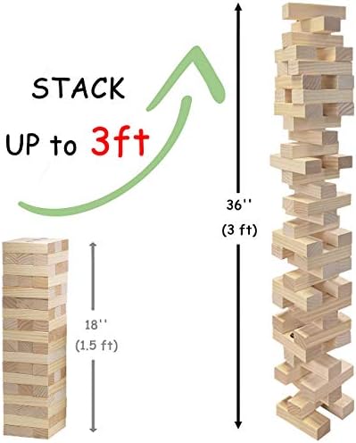 Stacked tower of wooden blocks with a player removing a block in a tabletop game setting.
