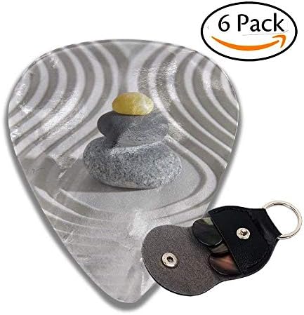 Three Hot Massage Stones In The Middle Of The White Sand Shaped Waves Colorful Celluloid Guitar Picks Plectrums For Guitar Bass .6 Pack 71mm