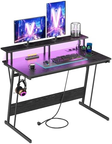 Secretária de jogos com luzes LED e tomadas de alimentação embutidas, secretária com prateleira para 2 monitores, mesa de quarto de escritório, 100 x 55 cm, preto ébano LWD191B56V2