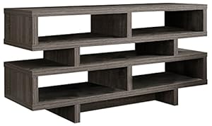 TV sitting on wooden console in a living room