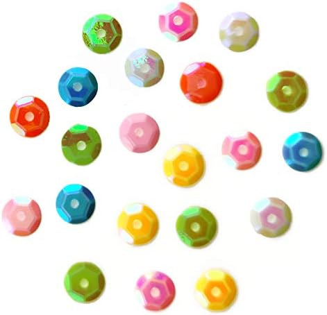 Colorful sequins in a cup, suitable for DIY projects.