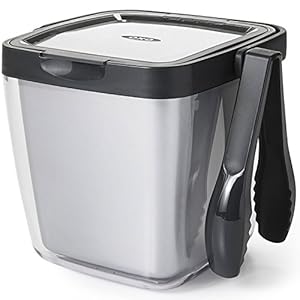 Ice bucket with tongs hanging from side