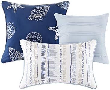 Marina coverlet set with decorative pillows on display.