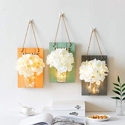 Mason jar wall sconces with decorative elements, priced at $18.99.