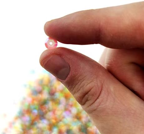 Colorful sequins in a cup - 100,000 pieces for DIY projects.