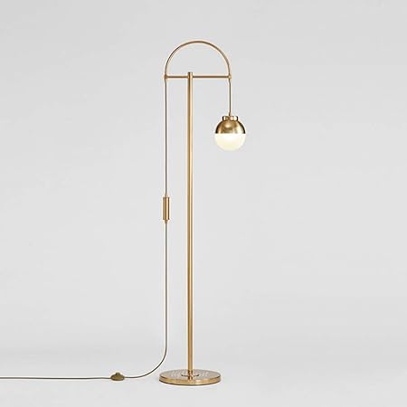 gold floor lamp next