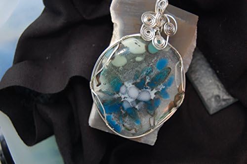 "Profusion" A Sterling Sliver Wire Wrapped Galaxy Glass Pendant. This is a Handmade Galaxy Glass Pendant - Shades of Blue and Grey Seem to be Suspended in Air.