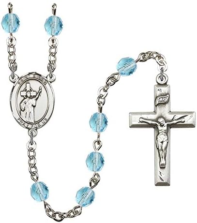 Silver Plate Rosary features 6mm Aqua Fire Polished beads. The Crucifix measures 1 3/8 x 3/4. The centerpiece features a St. Aidan of Lindesfarne medal.