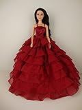 A Deep Red Gown with Layers of Ruffle Details Made to Fit the Barbie Doll