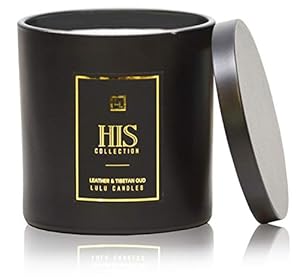 Black candle with gold lettering