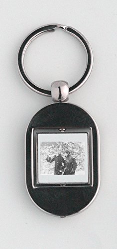 Catherine Deneuve and Jean-Paul Belmondo walking in snow. keychain