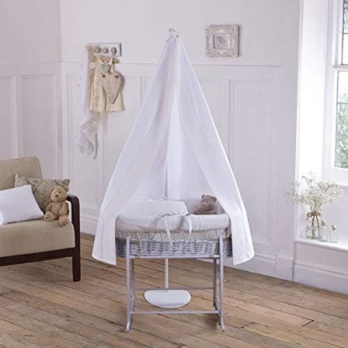 grey moses basket with drapes