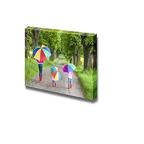 Mother and Her Daughters with Umbrellas in Spring...