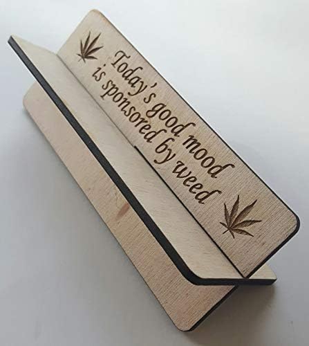 Wooden rolling up stand with slogan on 'Today's good mood is sponsored by weed'