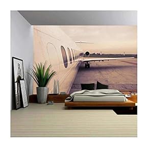 BRAND_NAMEAirplane Parked in Airport Waiting for Boarding Passengers