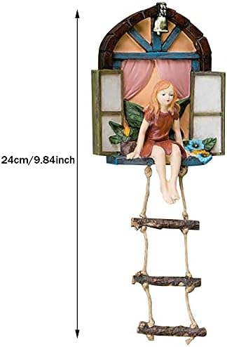 Fairy tree sculpture in a garden setting.