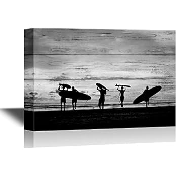 wall26 - Water Entertainment Canvas Wall Art - Silhouette of Surfer People Carrying Their Surfboard on Sunset Beach - Gallery Wrap Modern Home Decor | Ready to Hang - 24x36 inches