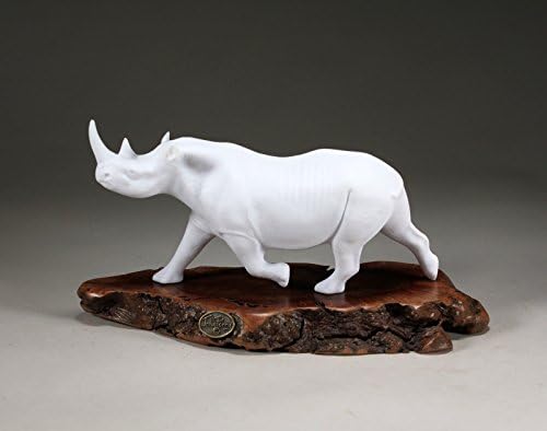 BLACK RHINO Pellucida by John Perry 9 inches long on burl slab