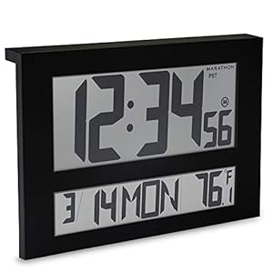 Standing atomic clock which is showing the time