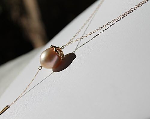 Pearl gold choker with a beautiful pink Kasumi pearl and a long drop and gold baton at the end.