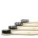 Bamboo Charcoal Toothbrush - Natural Biodegradable And Organic With 100% Eco Friendly BPA Free Bristles Smooth Wood Handle And Zero Waste Packaging - Pack Of 4 Wooden Toothbrushes By BambooEarth