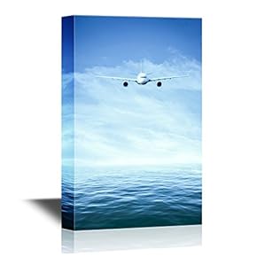 Canvas Wall Art - Airplane Flying Above The Sea in Clear Blue Sky - Gallery Wrap Modern Home Art | Ready to Hang - 12x18 inches