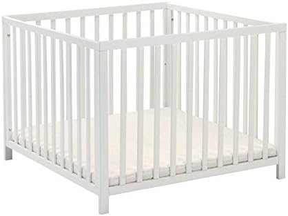 white wooden playpen