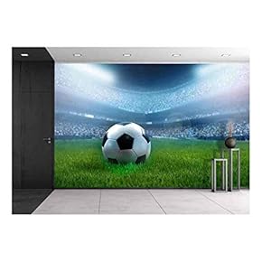 BRAND_NAMEClose Up of a Football Ball on a Full Stadium