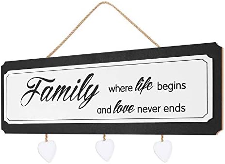 Colorful wooden sign with the words "Home Sweet Home" in a whimsical font, adorned with small painted flowers and hearts.