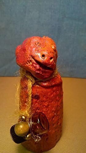 Jim Bob. Sea Monster Charm. A unique, one of a kind, hand sculptured gift. I'm a fish perched up on a rock. I have a bottle of Tea Tree Oil hanging by my side to give as a gift to my one true love.