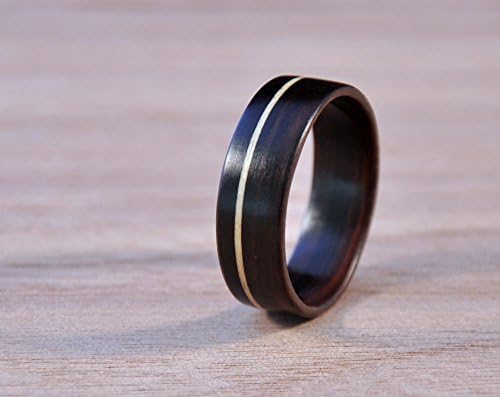 Ebony ring with offset sycamore inlay. Suitable as a wedding band, engagement ring or promise ring. Wooden jewellery for man and woman.