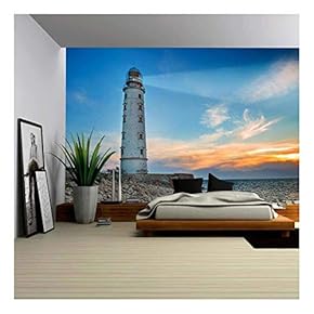 Lighthouse Searchlight Beam Through Sea Air at Night. Seascape at Sunset - Removable Wall Mural | Self-Adhesive Large Wallpaper - 66x96 inches