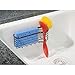 mDesign Metal Kitchen Sink Center Storage Caddy with Built-In Dishwashing Brush Holder- Suction Mount - Basket Holds: Pot Scrubbers, Scouring Pads, Sponges - Black Chrome