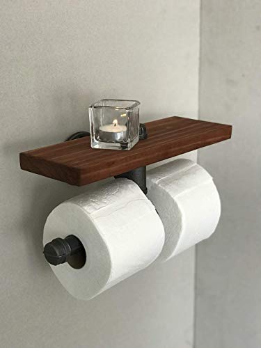 Dispensador de papel higiénico. Está diseñado para soportar dos rollos