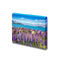 Mountain Lake with Blooming Flowers on Foreground