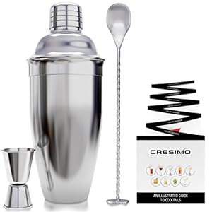 Shaker set with jigger and spoon on white background
